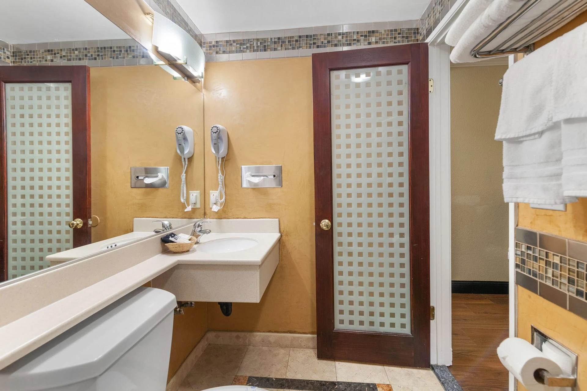 Private clean bathroom showing vanity mirror and shower